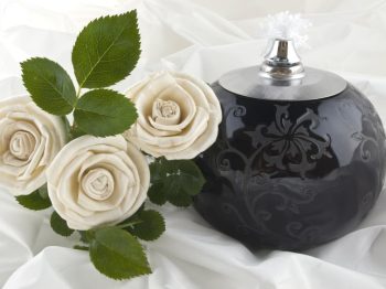 Roses and a oil lamp on satin